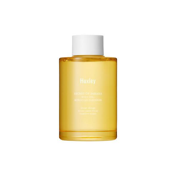 Yellow bottle with white cap on a white background AgelessBeauty3000.com Huxley | Body Oil in Moroccan Gardener