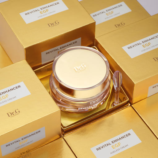 AgelessBeauty3000.com Dr.G | Revital Enhancer EGF Ageless Cream Gold cosmetic jar with lid on a matching gold background