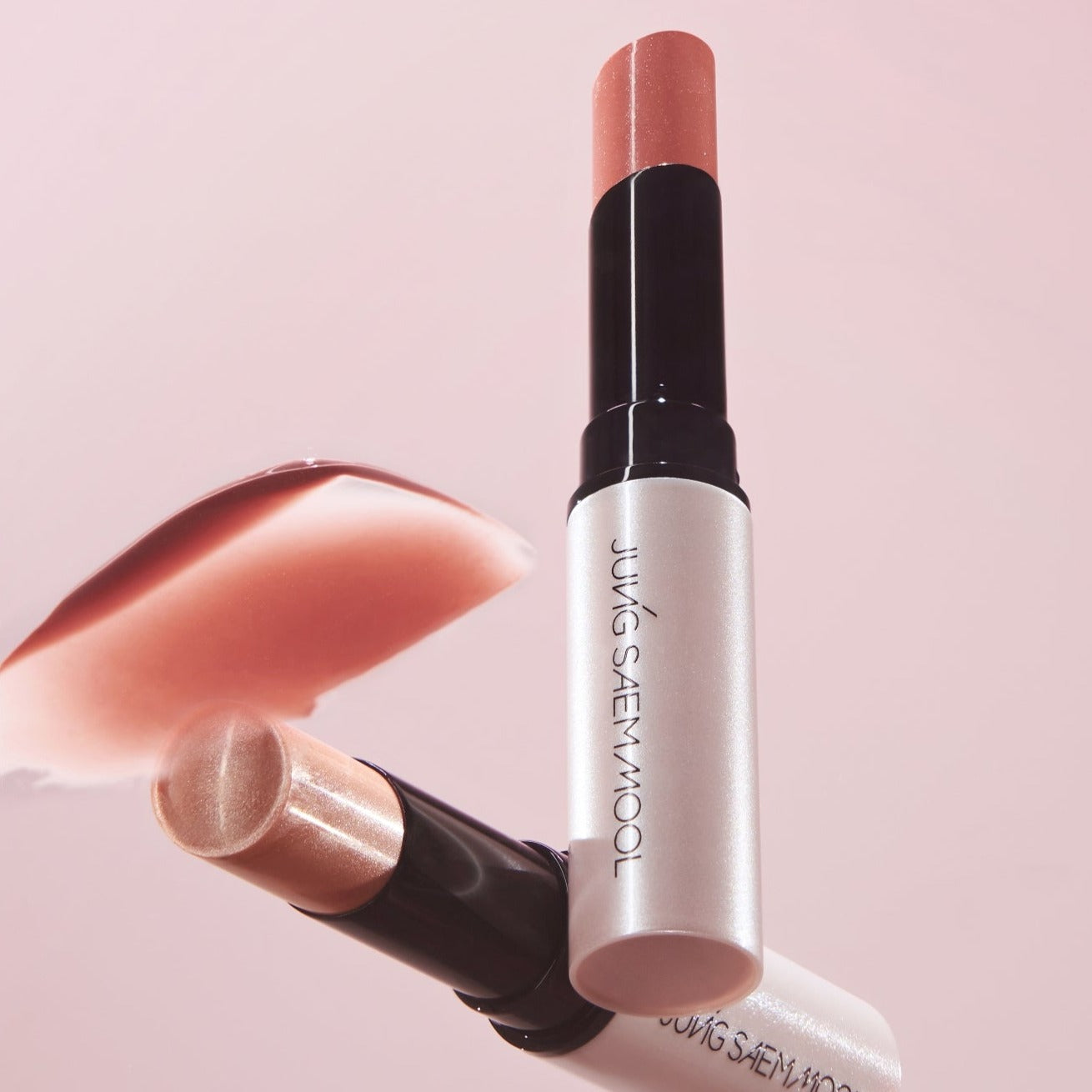 AgelessBeauty3000.com  JUNGSAEMMOOL| LIP-PRESSION Glow Lip Balm    Lipstick with visible brand name on a pink background