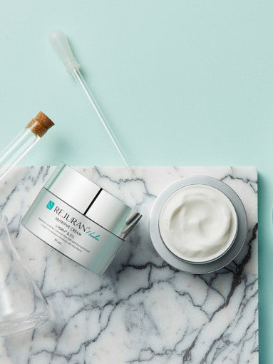 AgelessBeauty3000.com  Cosmetic jar with cream on a marble surface