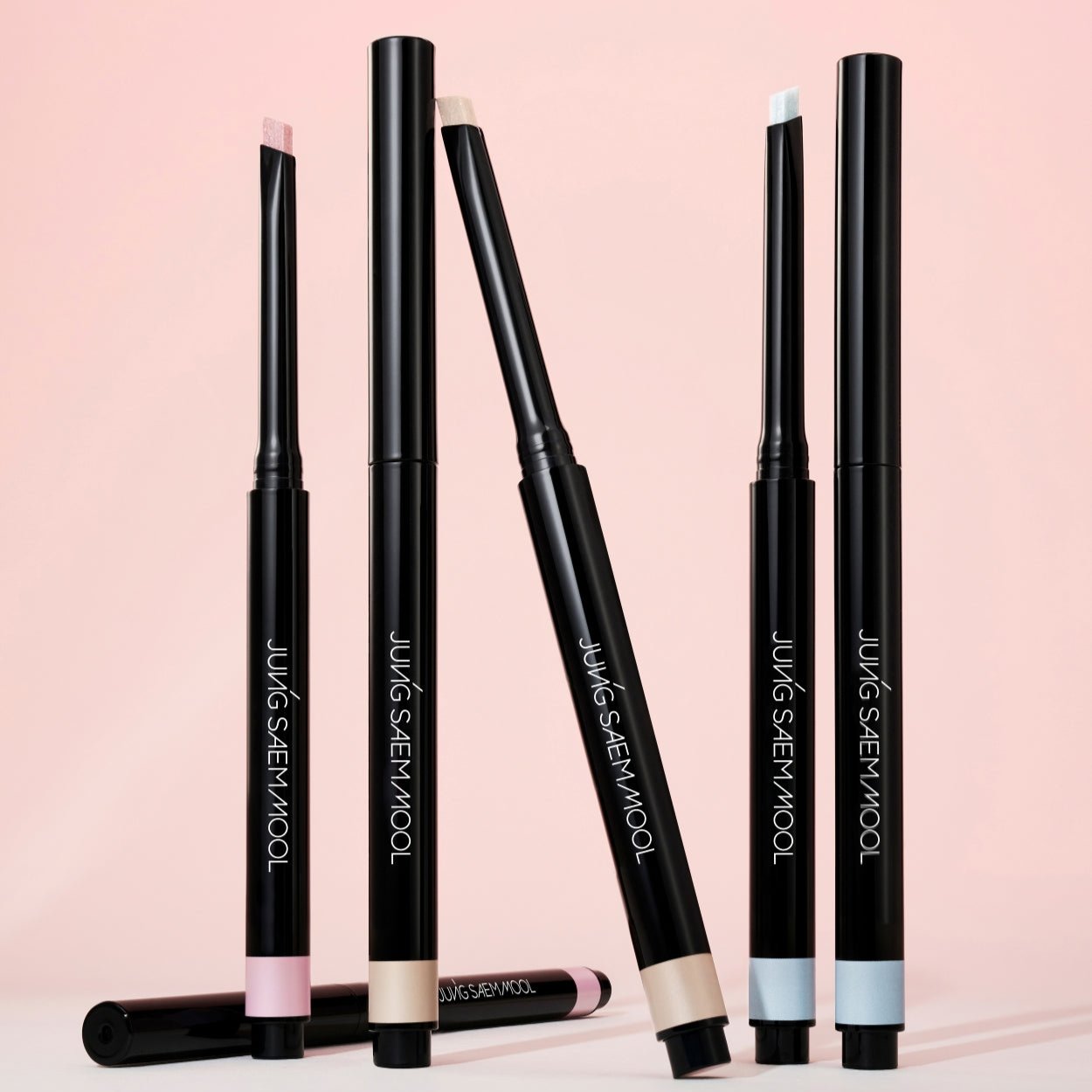 Set of Juun.J cosmetic products on a pink background  AgelessBeauty3000.com   JUNGSAEMMOOL  |  Artist Drawing Shadow Pencil