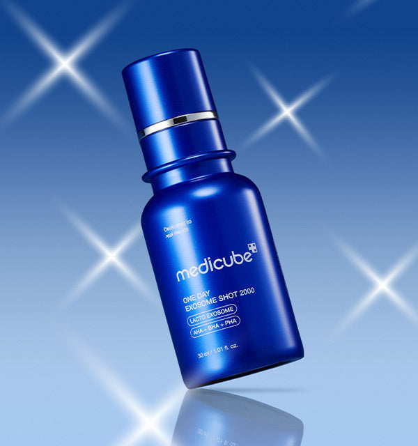 AgelessBeauty3000.com  medicube |One Day Exosome Shot Pore Ampoule 2000 Blue Medicube serum bottle on a blue background with starlight effects