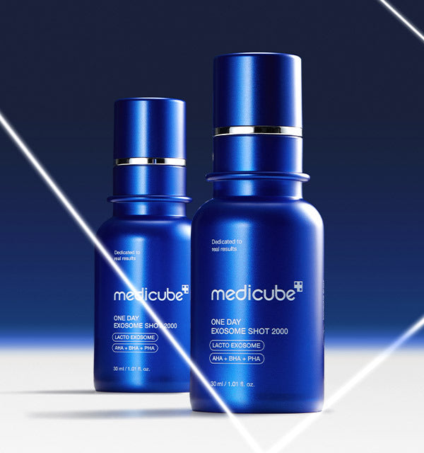 AgelessBeauty3000.com  medicube |One Day Exosome Shot Pore Ampoule 2000 Two blue bottles of Medicube skincare product on a gradient blue background