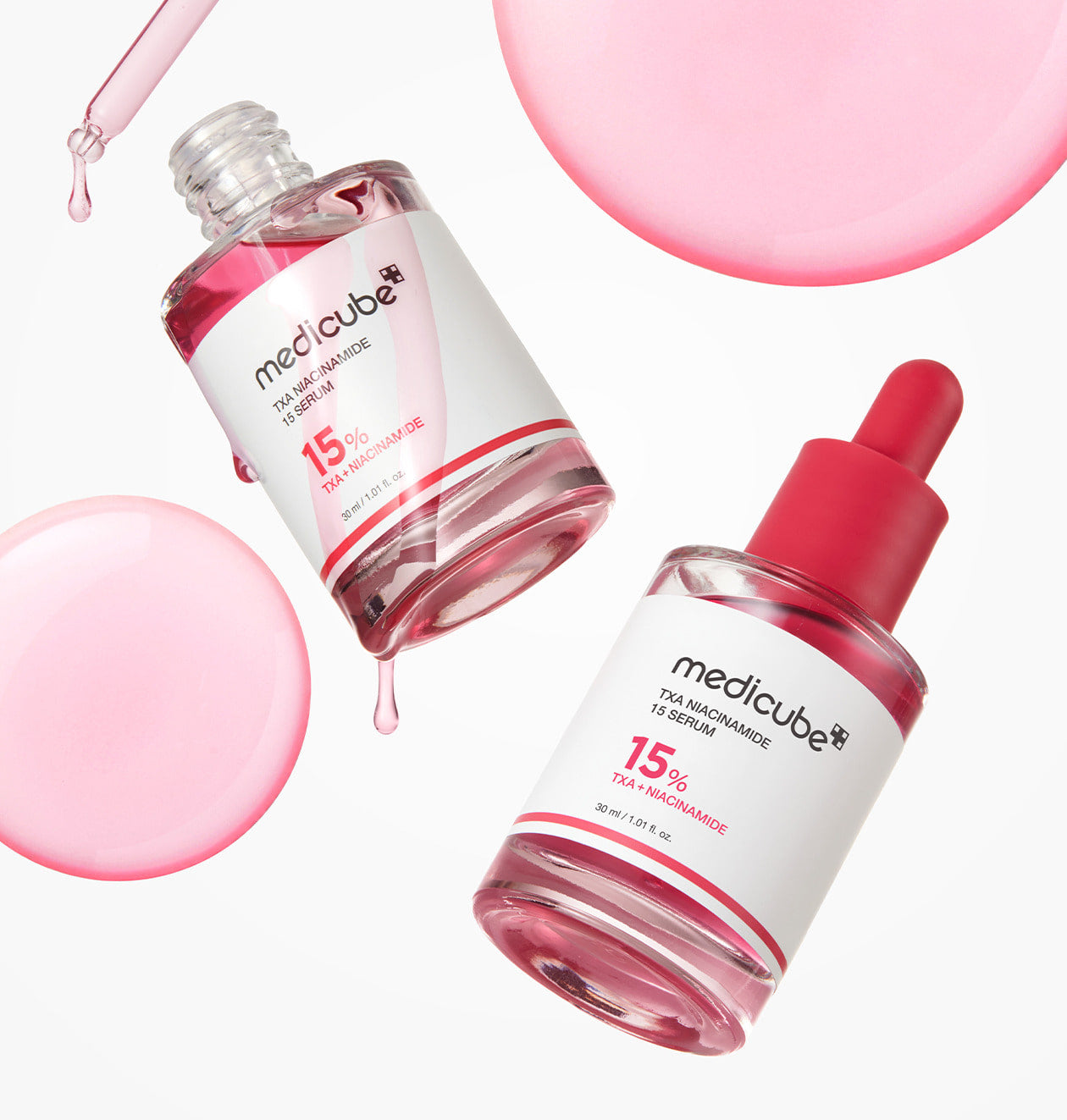 AgelessBeauty3000.com  medicube | TXA Niacinamide 15% Serum  Two bottles of Medicube serum with pink dropper on a white background