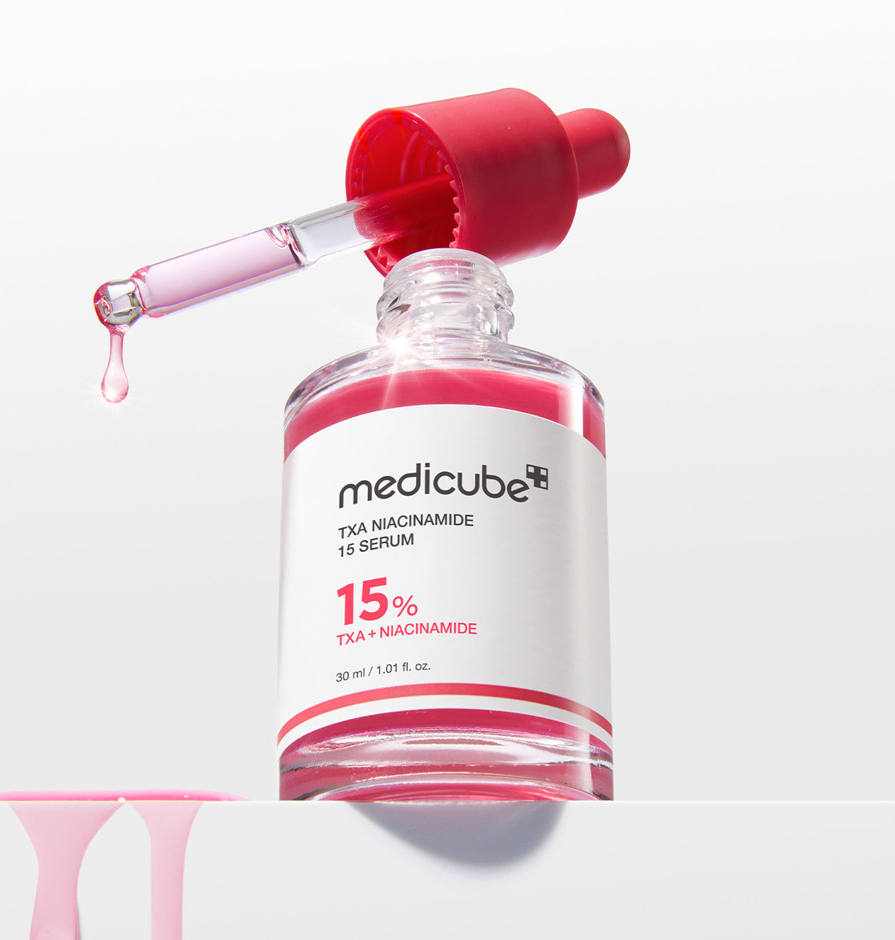 AgelessBeauty3000.com  medicube | TXA Niacinamide 15% Serum   Medicube TXA Niacinamide 15% serum bottle with dropper on a white background