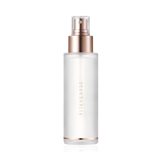 Skincare bottle with rose gold cap and base on a white background  AgelessBeautz3000.com  DEAR DAHLIA |  Endless Skin Setting Spray