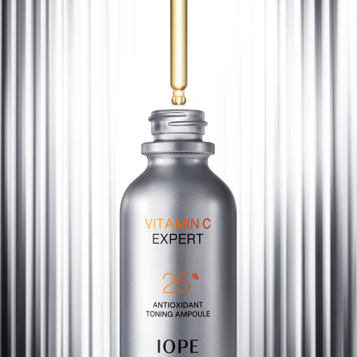 IOPE Vitamin C Expert Ampoule bottle on a gray background  AgelessBeauty3000.com  IOPE  |   Vitamin C Expert 25% Antioxidant Toning Ampoule
