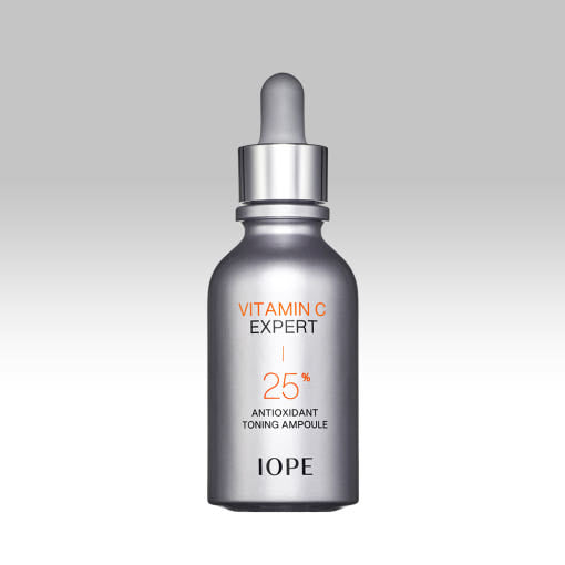 IOPE Vitamin C Expert Ampoule bottle on a gray background  AgelessBeauty3000.com  IOPE  |   Vitamin C Expert 25% Antioxidant Toning Ampoule