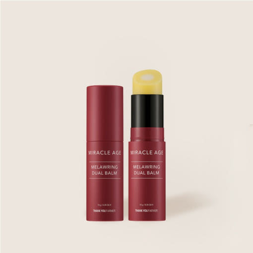 Two Miracle Age Melawring Dual Balms on a beige background  AgelessBeauty3000.com  THANK YOU FARMER  |  Miracle Age Melawring Dual Balm