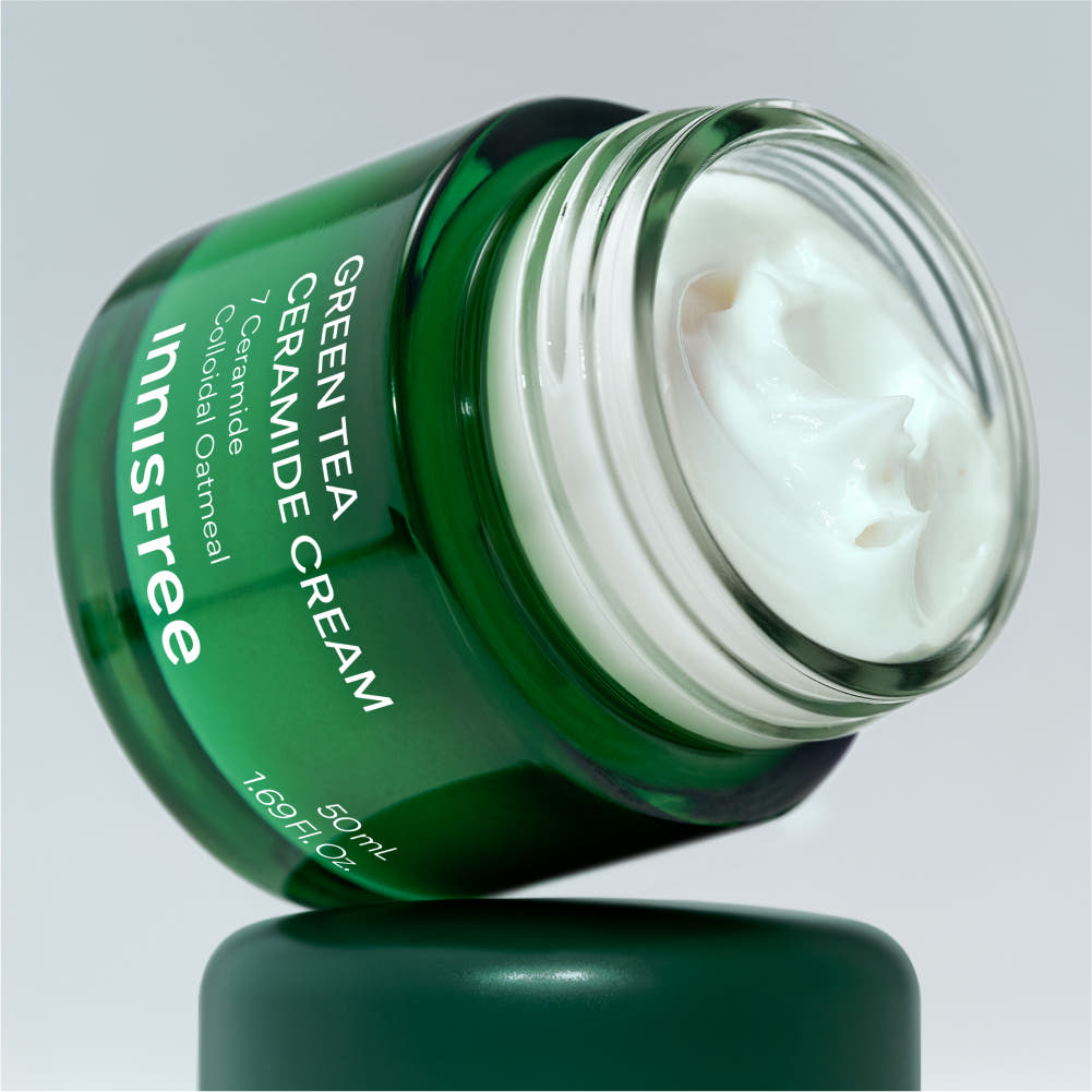 AgelessBeauty3000.com  innisfree | Green Tea Ceramide Cream   Green tea ceramide cream jar with visible cream on a gray background