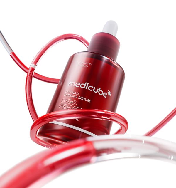 AgelessBeauty3000.com  medicube | EGF NAD Firming Serum    Red serum bottle with dropper labeled 'medicube' on a white background